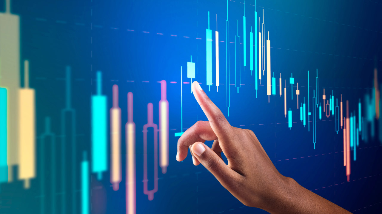 a hand pointing at a digital stock market chart with glowing candlesticks