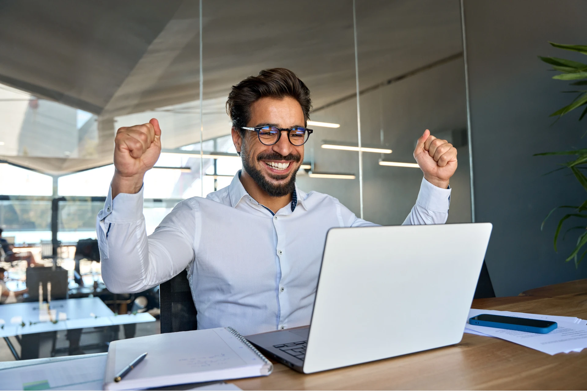 a man raising his two hands