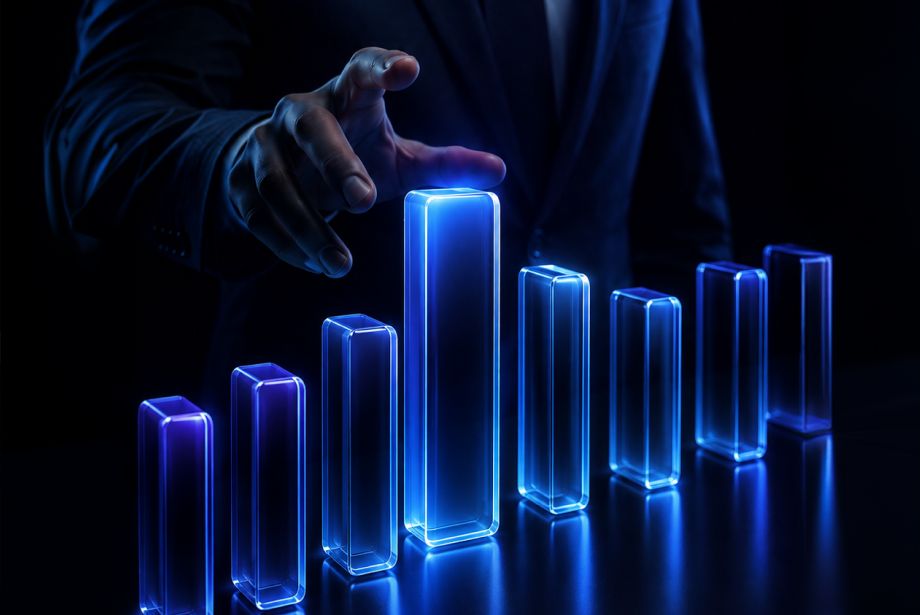 Businessperson reaching toward a glowing blue bar chart, representing trading growth, market performance, and financial progress.