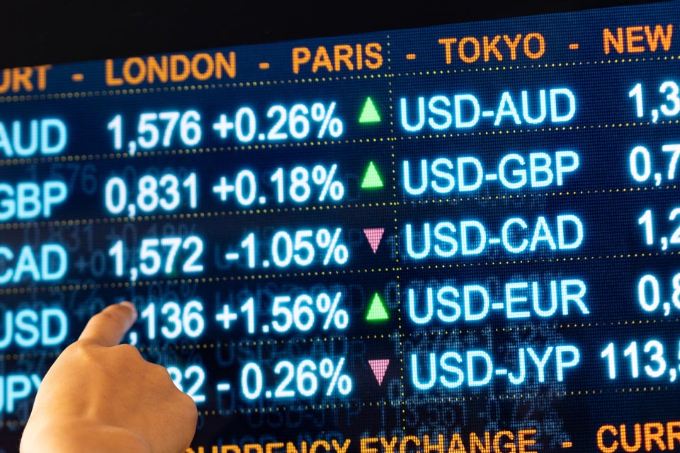 Forex trading board displaying live exchange rates of major currency pairs, illustrating the concept of PIP in forex trading.