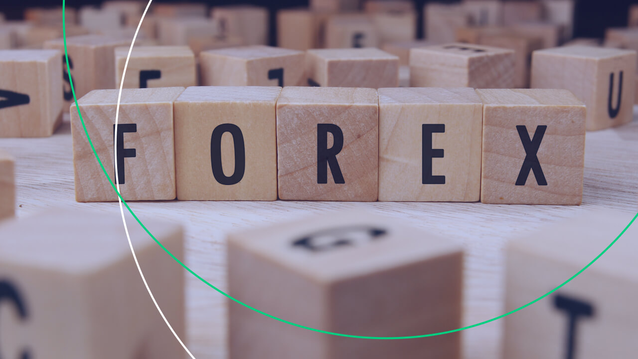 Wooden letter blocks arranged to spell "FOREX," representing the foreign exchange market, illustrating the title "Forex Words and Jargons Every Trader Should Know."