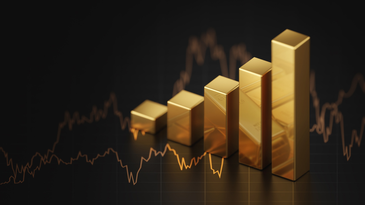 Stack of gold bars arranged to visualize an upward trending chart, representing the "Gold Price Forecast For 2024."