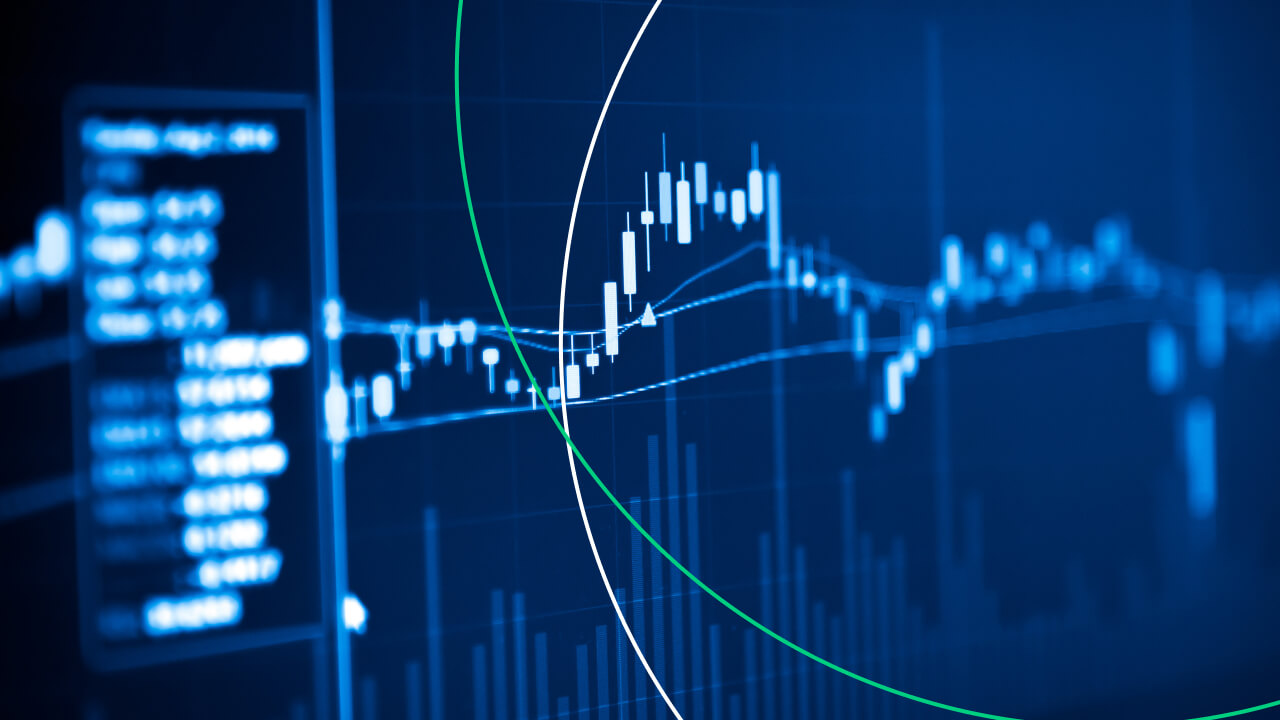 blue-themed stock market trading chart displaying candlestick patterns and volume bars