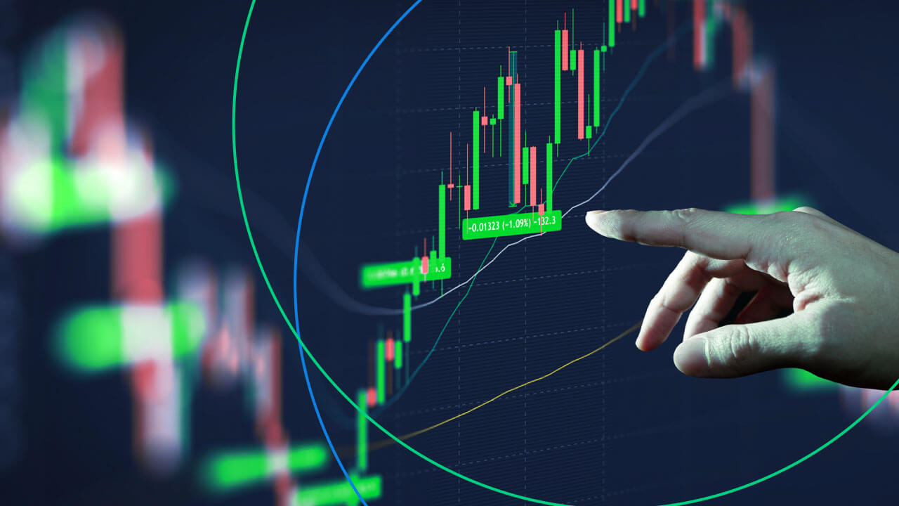 Hawkish vs. Dovish: How Do They Affect the Forex Market – A visual representation of a financial market chart with a hand interacting, symbolizing market sentiment shifts influenced by central bank policies.