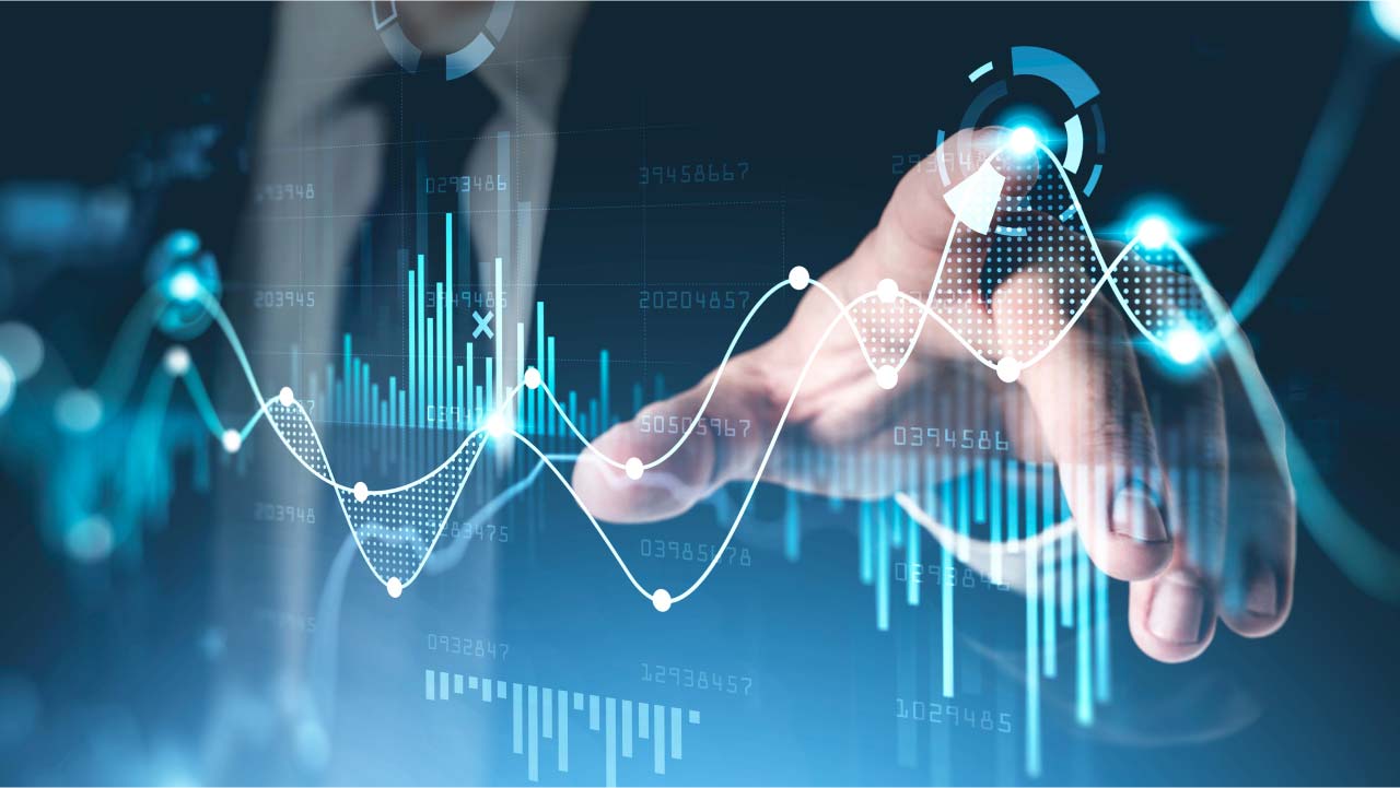 a hand interacting with a digital interface displaying financial charts & graphs