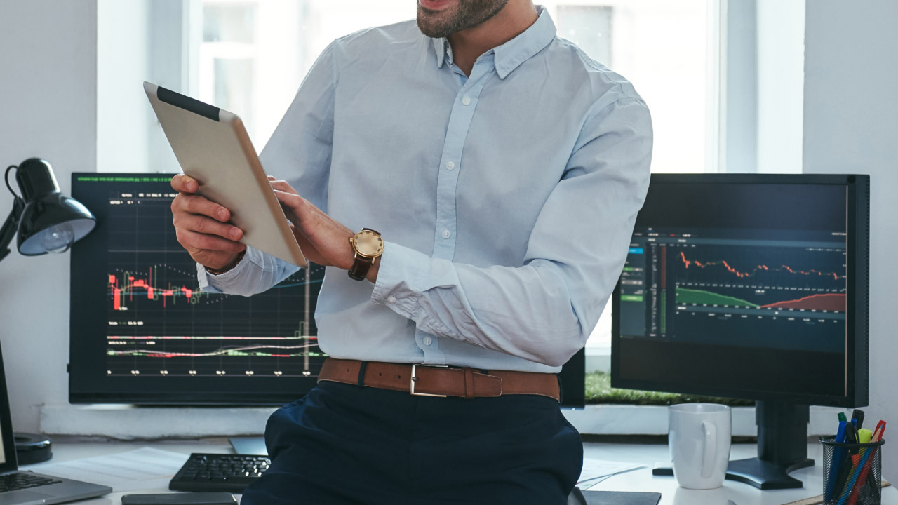 man analyzing data in a tablet