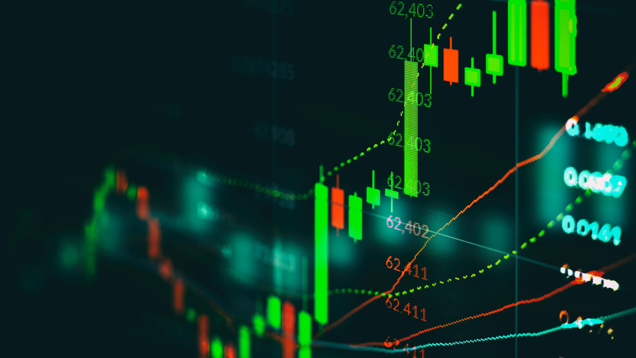 a digital financial chart with candlestick patterns in green and red, showing market trends