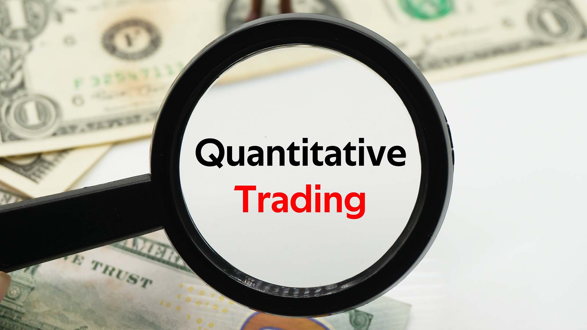 Beginner's Guide to Quantitative Trading illustrated by a magnifying glass over a money-themed background, highlighting the text "Quantitative Trading" to emphasize the focus on data-driven strategies.