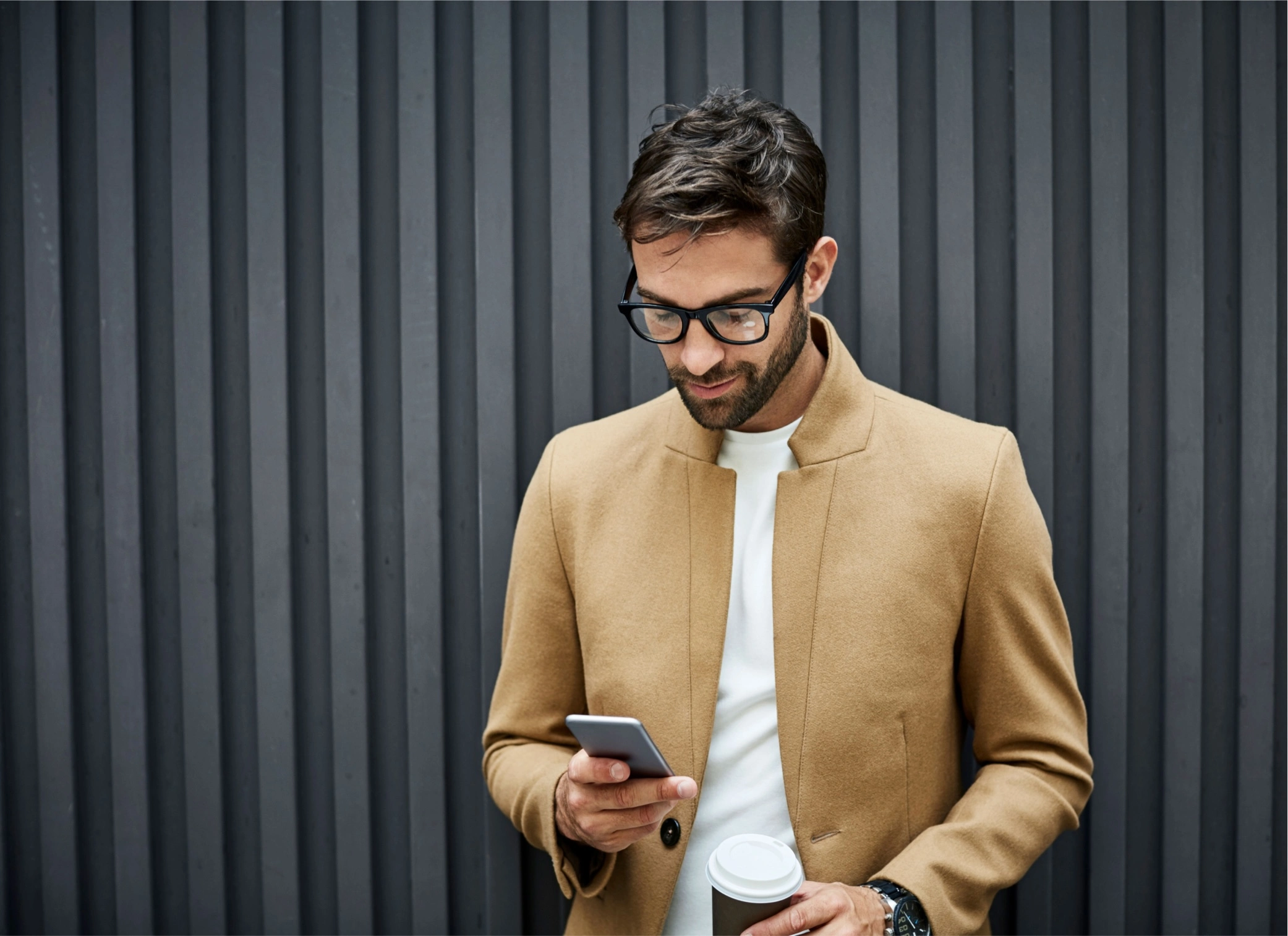 man with a glasses holding a phone