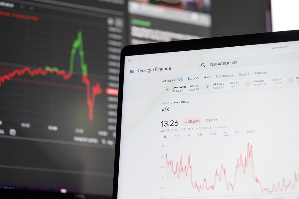 a computer screen showing Google Finance displaying the VIX index with charts 