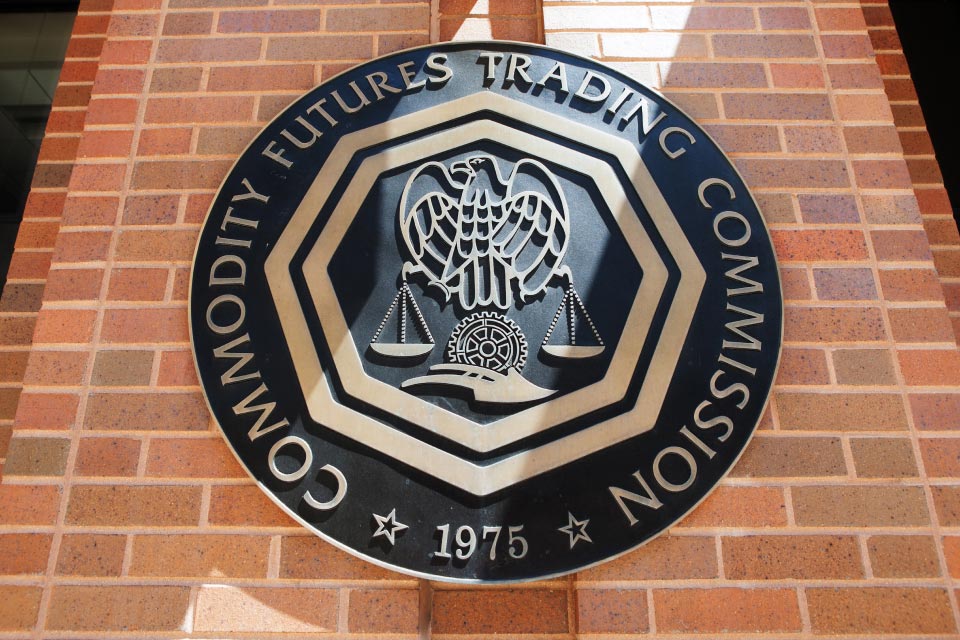 seal of the Commodity Futures Trading Commission (CFTC) on a brick wall